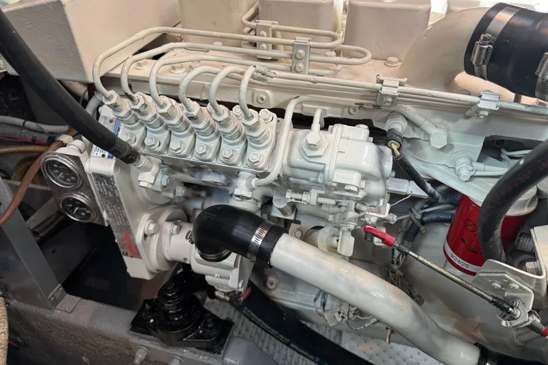 Engine compartment of a 1990 Sea Ray 380 Aft Cabin boat, showcasing mechanical components.