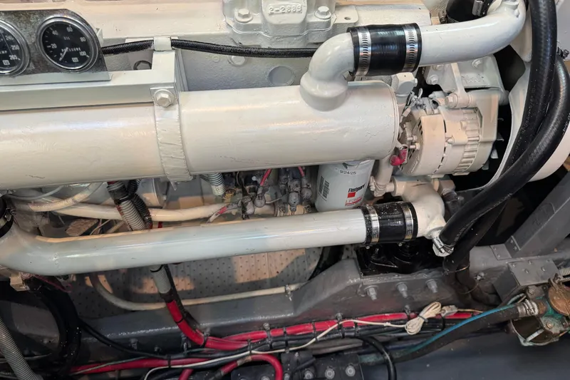 Engine compartment of a 1990 Sea Ray 380 Aft Cabin boat, showing detailed components.