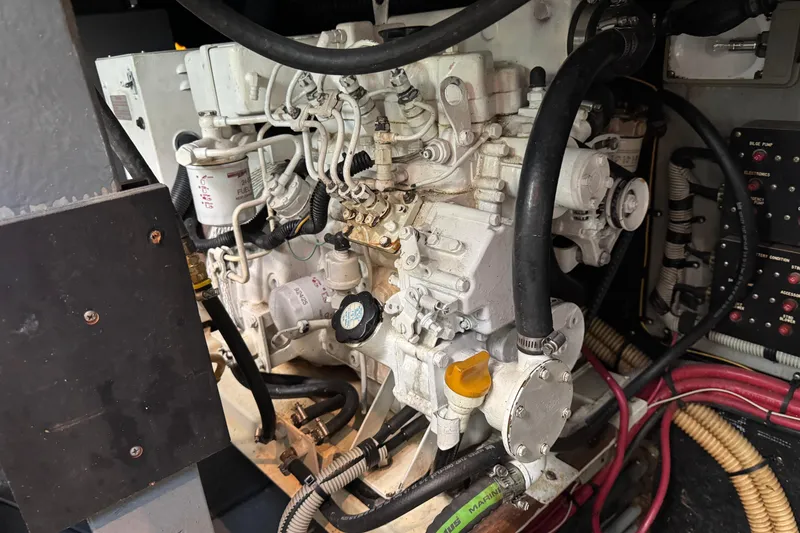 Engine compartment of a 1990 Sea Ray 380 Aft Cabin boat, showcasing mechanical components.