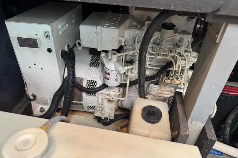 Engine compartment of a 1990 Sea Ray 380 Aft Cabin boat, showing mechanical components.