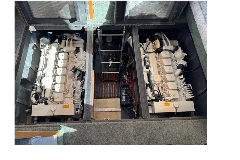 1990 Sea Ray 380 Aft Cabin engine compartment with dual engines visible.