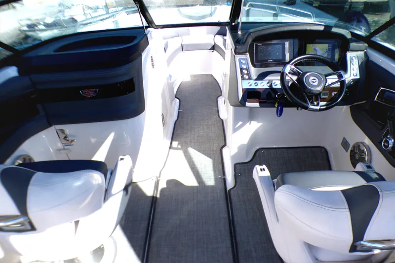 2018 Chaparral 267 SSX boat interior with modern dashboard and seating.