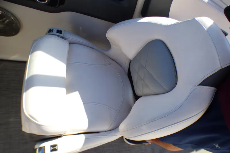 2018 Chaparral 267 SSX boat seat, white and gray upholstery, close-up view.