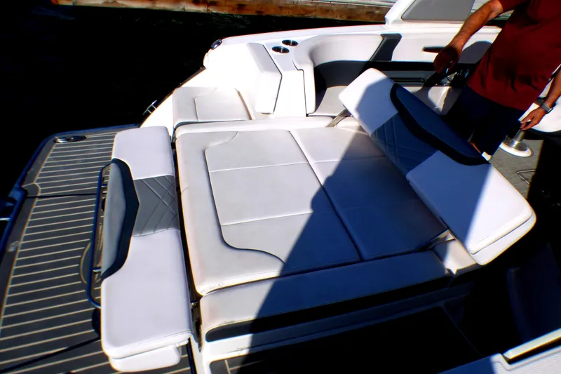 2018 Chaparral 267 SSX boat interior with cushioned seating and deck.
