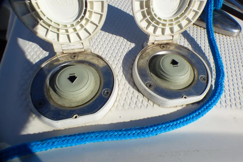 Fuel caps on a 2018 Chaparral 267 SSX boat with blue rope detail.