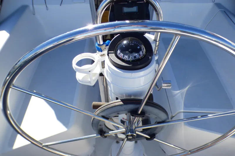 Steering wheel and compass of 1994 Hunter Legend 35.5 sailboat cockpit.