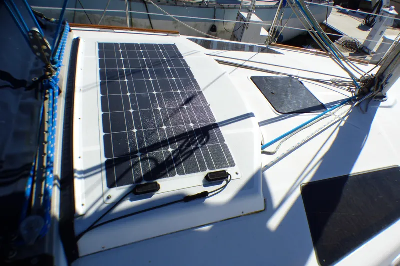 Solar panel on 1994 Hunter Legend 35.5 sailboat deck, harnessing renewable energy.