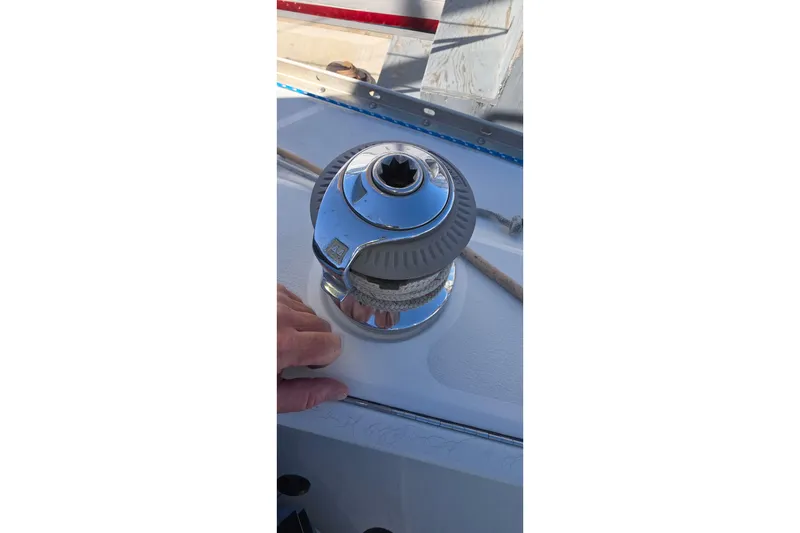 1994 Hunter Legend 35.5 sailboat winch with rope, close-up view.