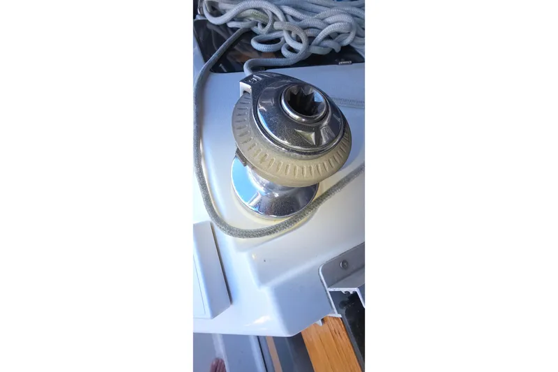 Winch on 1994 Hunter Legend 35.5 sailboat with coiled rope.