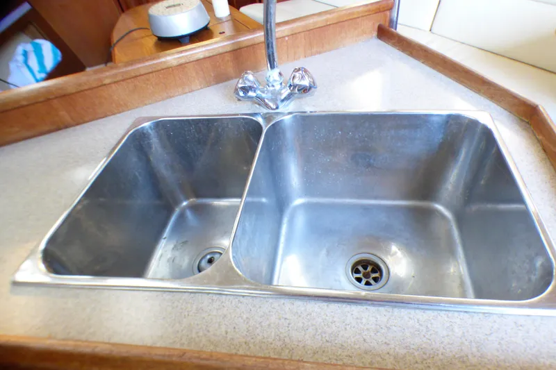 Stainless steel double sink in 1994 Hunter Legend 35.5 yacht kitchen.