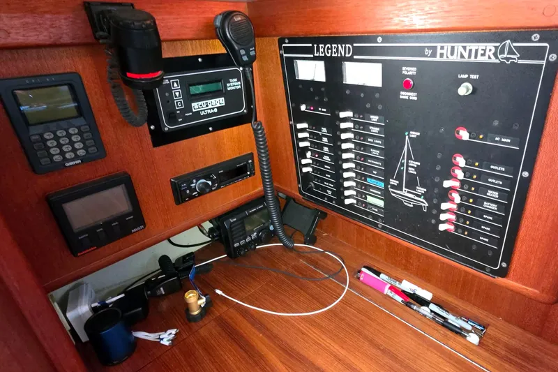 Control panel of a 1994 Hunter Legend 35.5 sailboat with navigation and communication equipment.