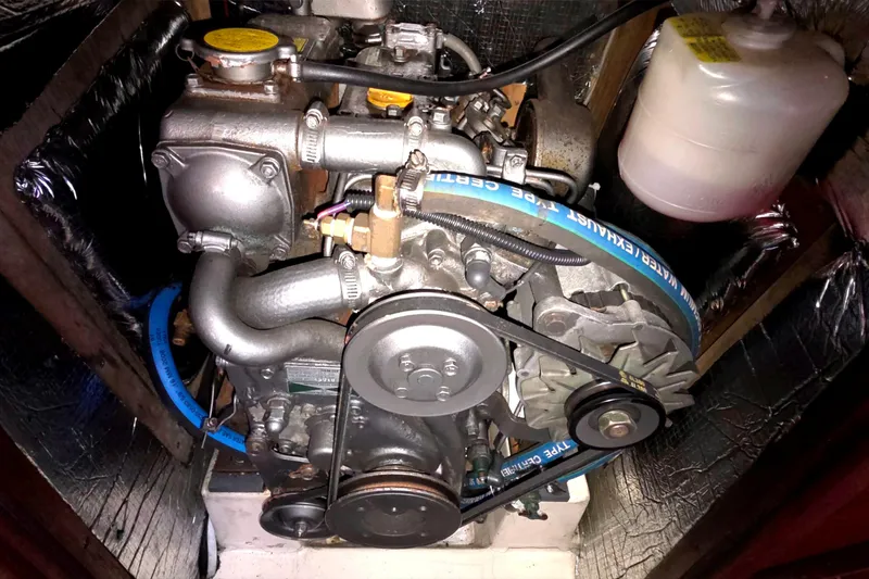 Engine of a 1994 Hunter Legend 35.5 sailboat, showcasing belts and components.