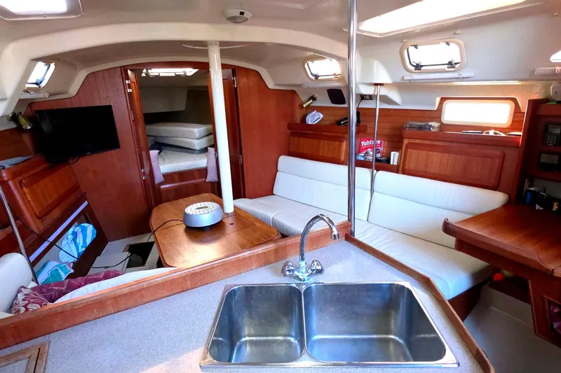 Interior of 1994 Hunter Legend 35.5 sailboat with cozy seating and modern amenities.