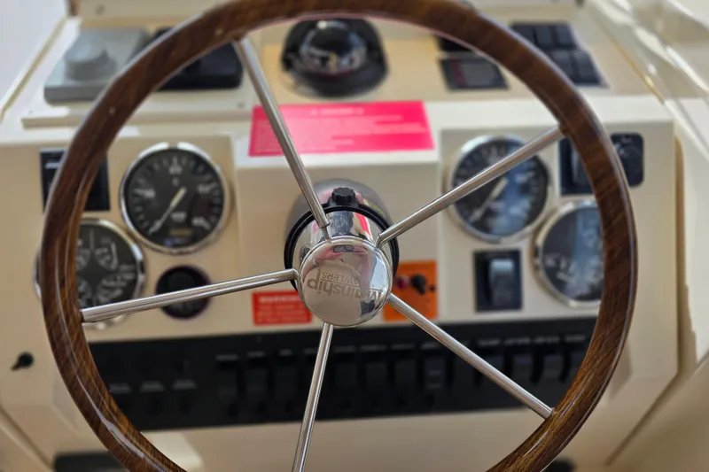 Steering wheel and dashboard of 2005 Mainship 34 Pilot Sedan Rum Runner II boat.