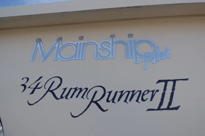 Mainship 34 Pilot Sedan Rum Runner II, 2005 model, boat nameplate detail.