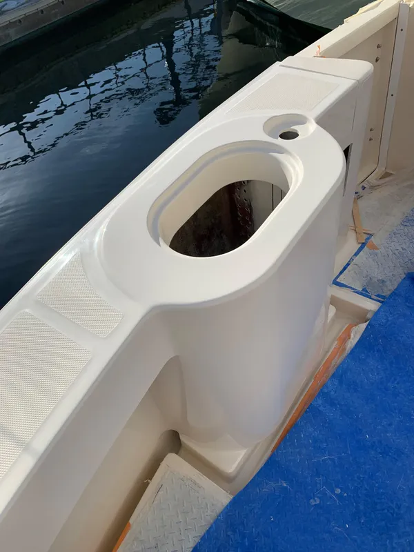 2005 Mainship 34 Pilot Sedan Rum Runner II boat deck detail by the water.