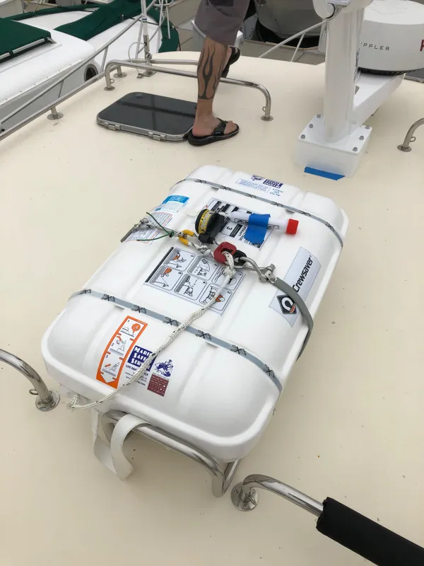 Life raft on 2005 Mainship 34 Pilot Sedan Rum Runner II deck.