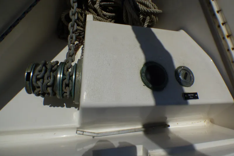 Anchor chain and water fill port on 1993 Hunter 40.5 sailboat deck.