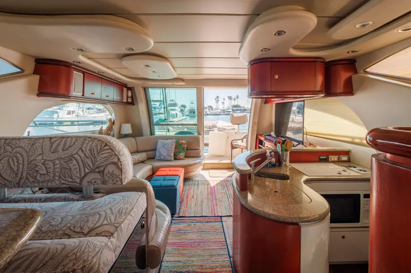Luxurious interior of a 1997 Maxum 4600 SCB yacht with modern furnishings and vibrant decor.