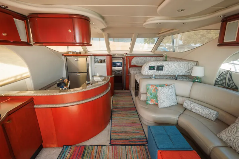 Luxurious interior of a 1997 Maxum 4600 SCB yacht with modern furnishings and vibrant decor.