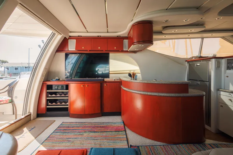 Luxurious interior of 1997 Maxum 4600 SCB yacht with modern kitchen and entertainment area.