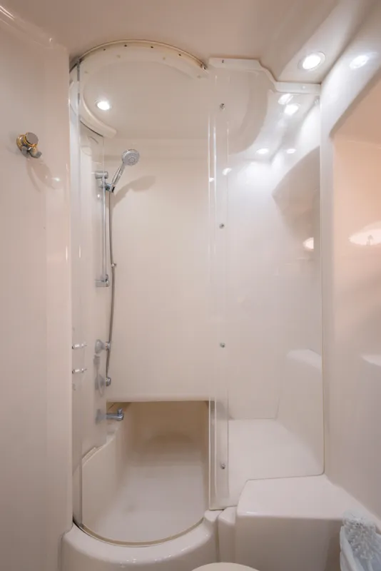 Luxurious shower in 1997 Maxum 4600 SCB yacht, featuring sleek design and modern fixtures.