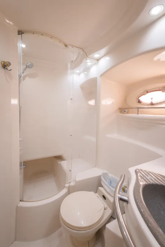 1997 Maxum 4600 SCB yacht bathroom with shower, toilet, and sink.