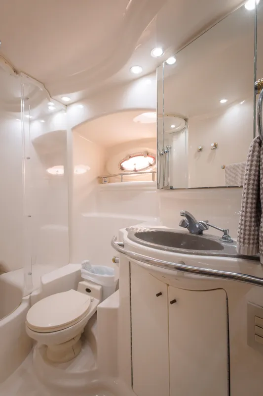 Luxurious bathroom in 1997 Maxum 4600 SCB yacht with modern fixtures and elegant design.