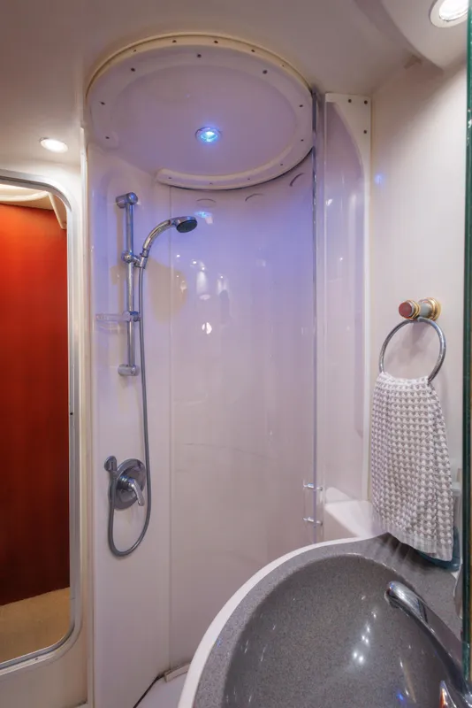 Shower area in 1997 Maxum 4600 SCB yacht with modern fixtures and lighting.
