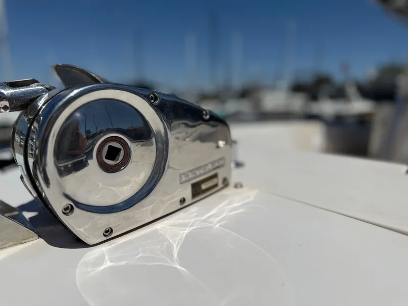 Close-up of a 2005 Grady-White Bimini 306 boat winch in sunlight.