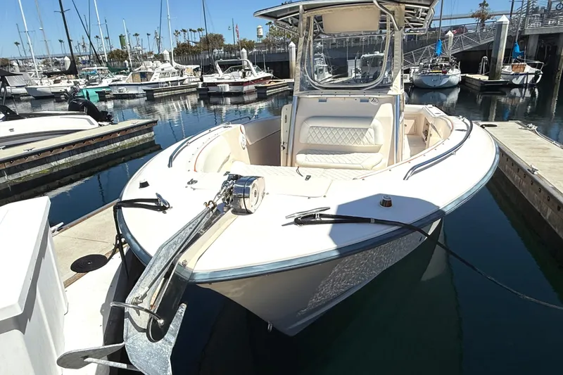 2005 Grady-White Bimini 306 boat docked at marina, front view.