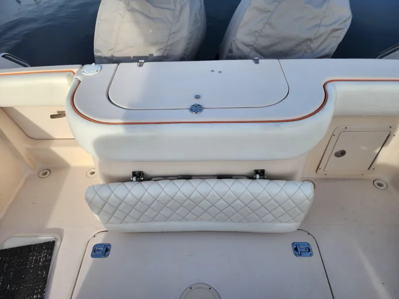 2005 Grady-White Bimini 306 boat interior with cushioned seating and storage compartments.