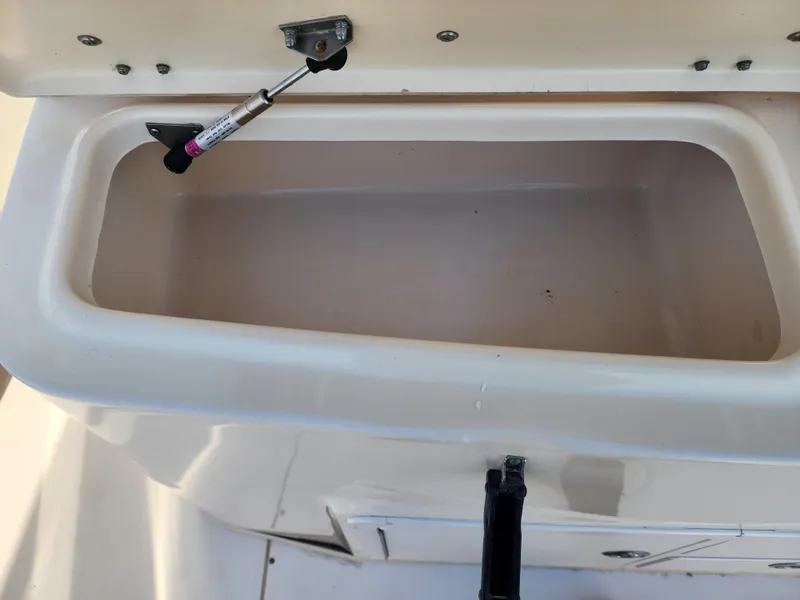 Open storage compartment on a 2005 Grady-White Bimini 306 boat.