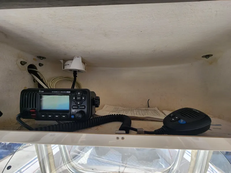 2005 Grady-White Bimini 306 boat radio equipment in storage compartment.