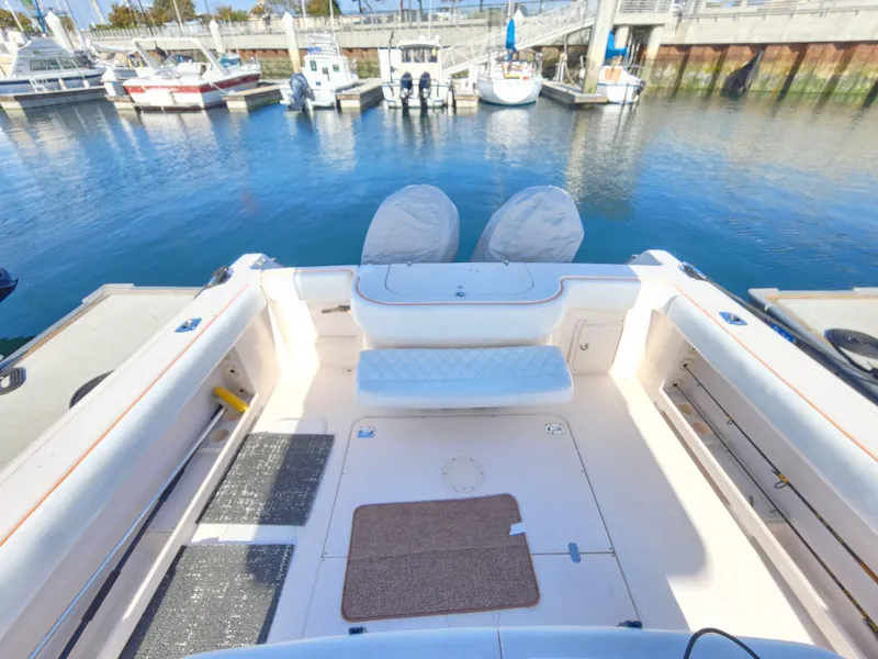 2005 Grady-White Bimini 306 boat docked at marina, spacious deck view.