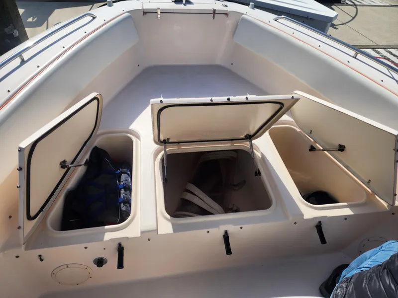 2005 Grady-White Bimini 306 boat storage compartments with open hatches.