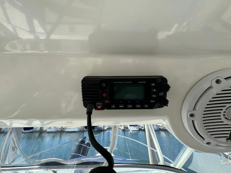 VHF radio and speaker on 2008 Boston Whaler 285 Conquest boat, docked at marina.