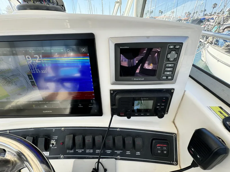 Control panel of a 2008 Boston Whaler 285 Conquest with navigation and communication equipment.
