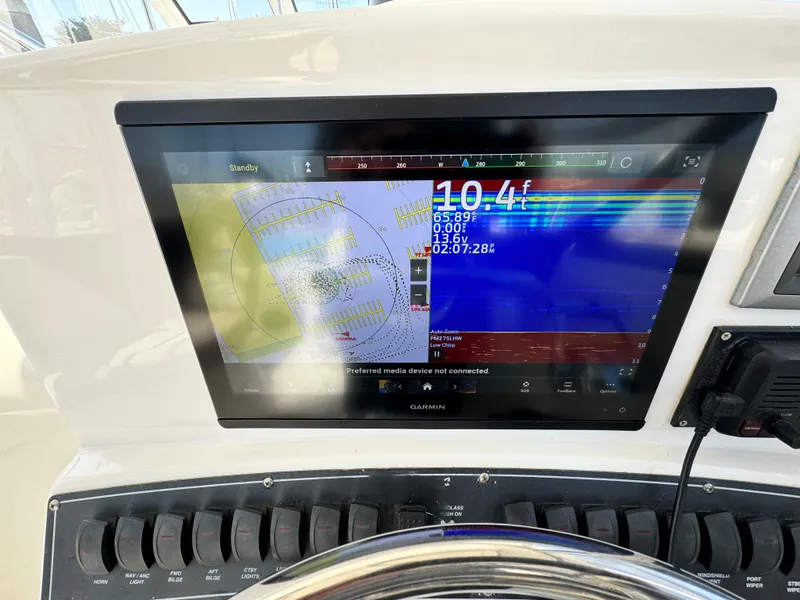 Dashboard of a 2008 Boston Whaler 285 Conquest with Garmin navigation display.