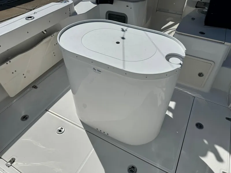 2008 Boston Whaler 285 Conquest deck with oval storage compartment.