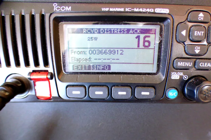 VHF marine radio displaying distress acknowledgment on Sea Ray 340 Amberjack, 2002 model.