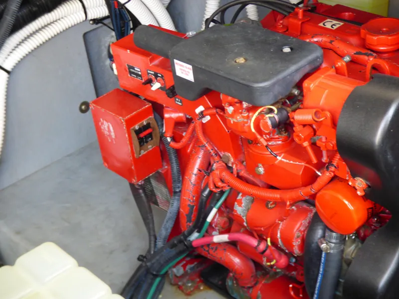 Engine compartment of 2002 Sea Ray 340 Amberjack, red engine.