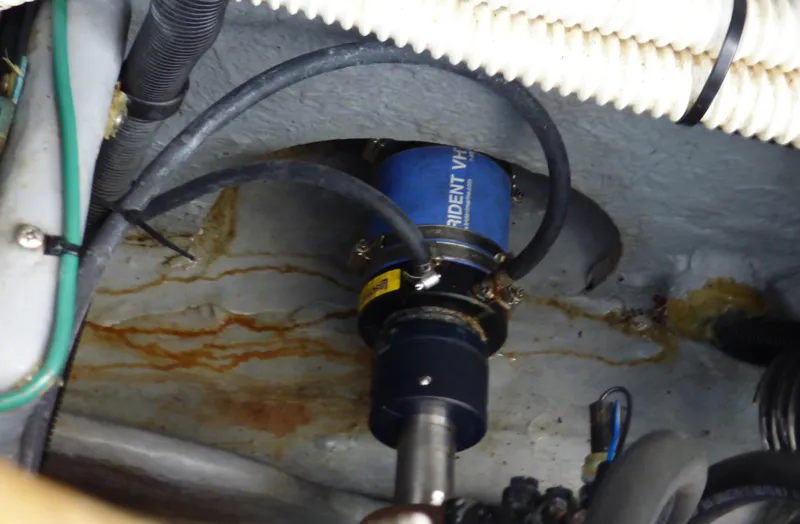 Engine compartment of 2002 Sea Ray 340 Amberjack with hoses and cables.