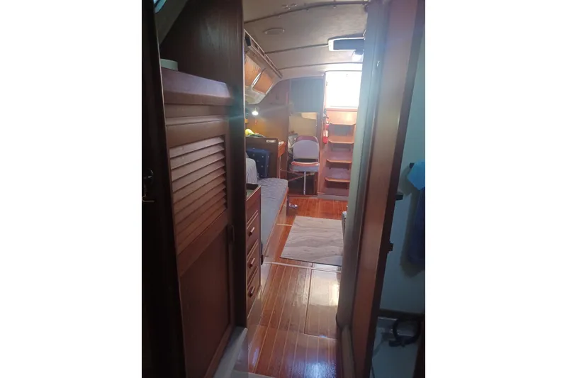 Interior of 1987 O'Day 40 sailboat with wooden flooring and cozy cabin space.