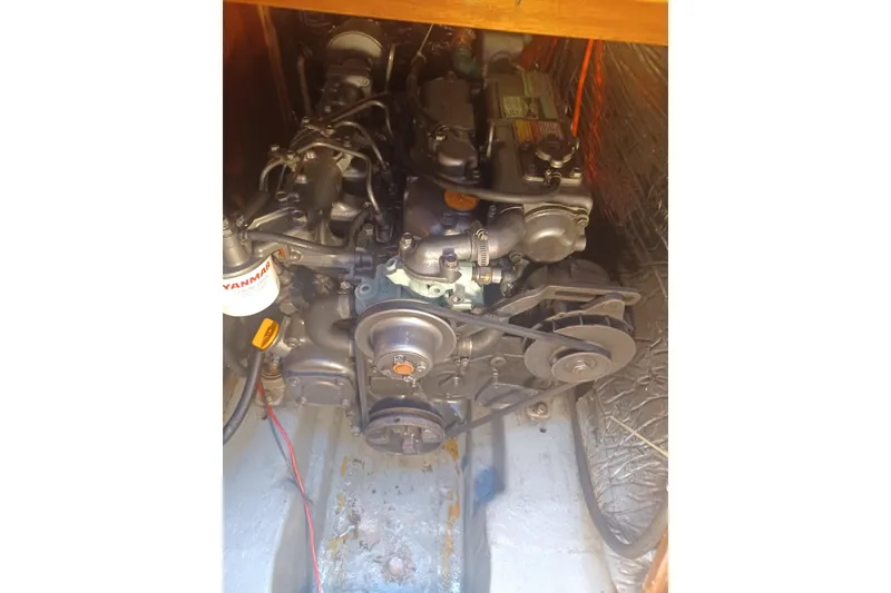 Engine compartment of a 1987 O'Day 40 sailboat, featuring a Yanmar engine.