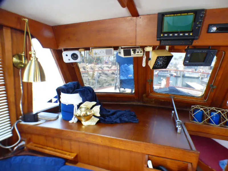 Interior of 1980 CHB Heritage 42 Trawler with navigation equipment and wooden finish.