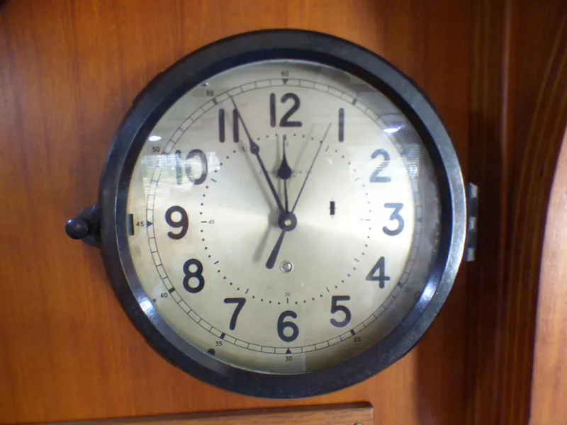 Vintage clock on 1980 CHB Heritage 42 Trawler wooden interior.