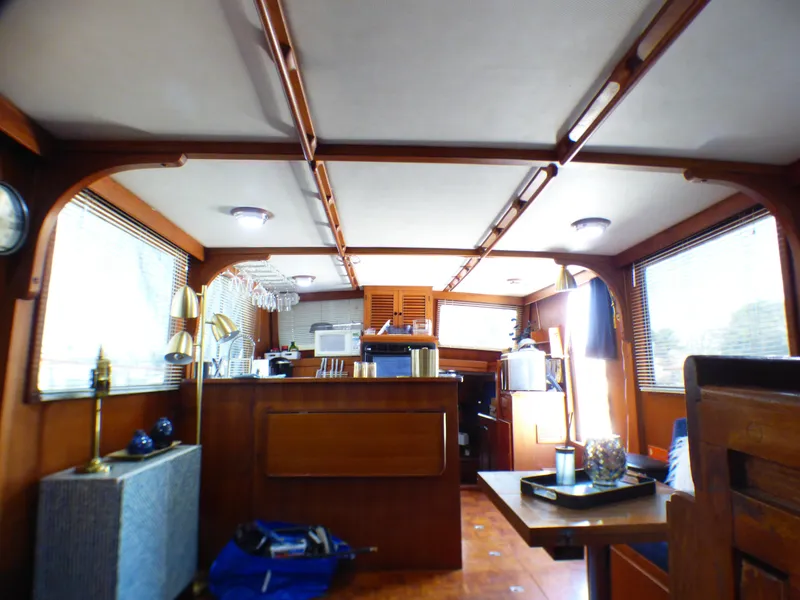 Interior of 1980 CHB Heritage 42 Trawler with wooden furnishings and modern amenities.