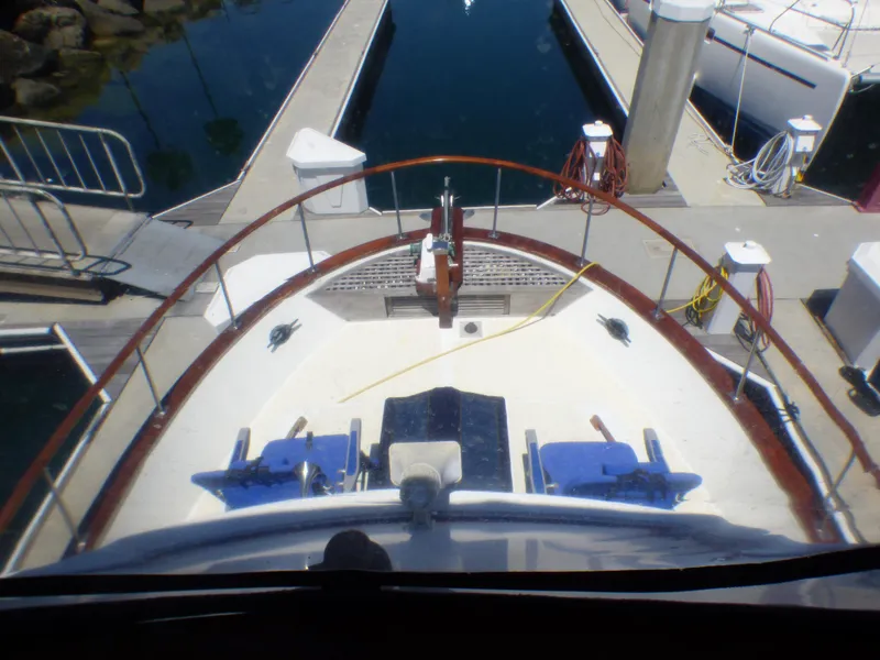 1980 CHB Heritage 42 Trawler docked at marina, view from helm.