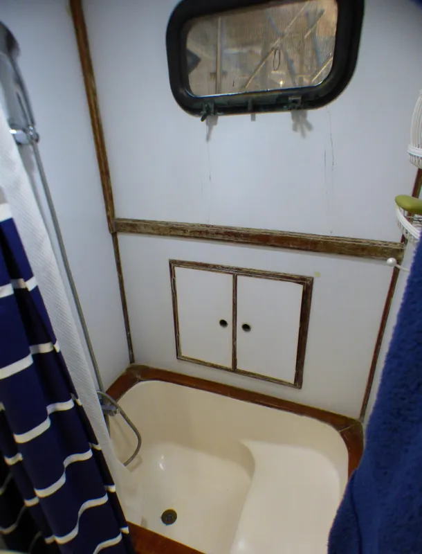 1980 CHB Heritage 42 Trawler bathroom with shower and porthole window.